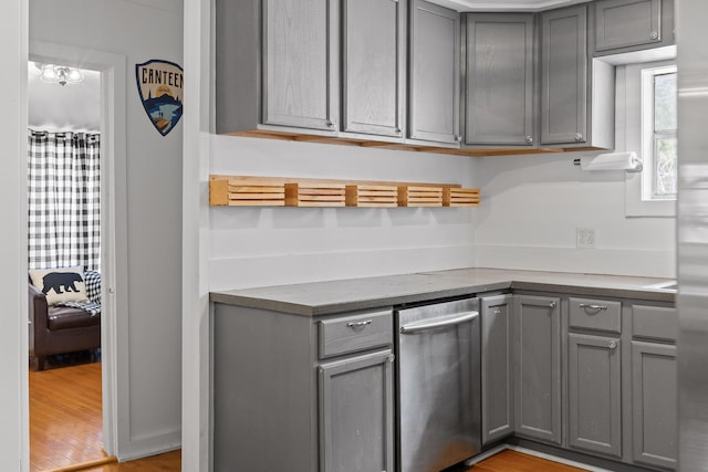 kitchen featuring light wood-type flooring and gray cabinets