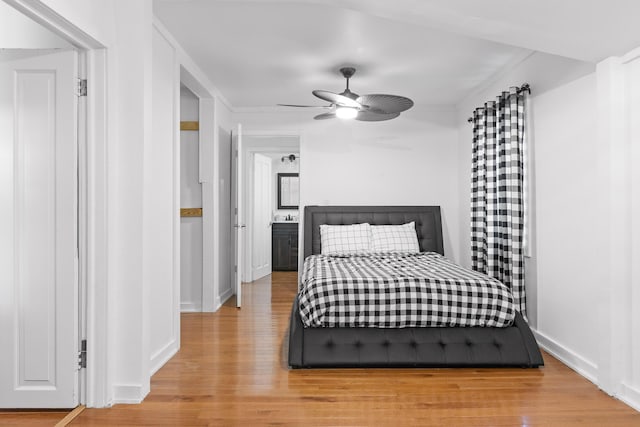 bedroom with ceiling fan and light hardwood / wood-style flooring