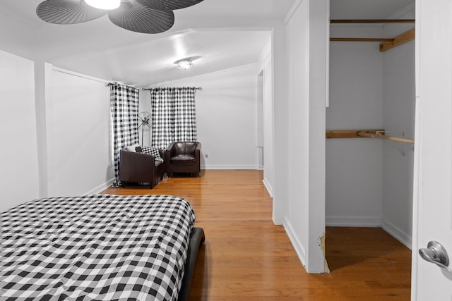 bedroom with light wood-type flooring and a closet