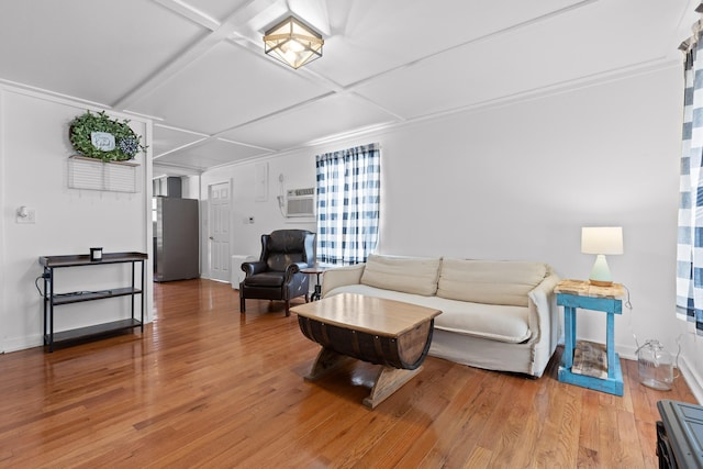 living room with coffered ceiling, hardwood / wood-style flooring, and an AC wall unit