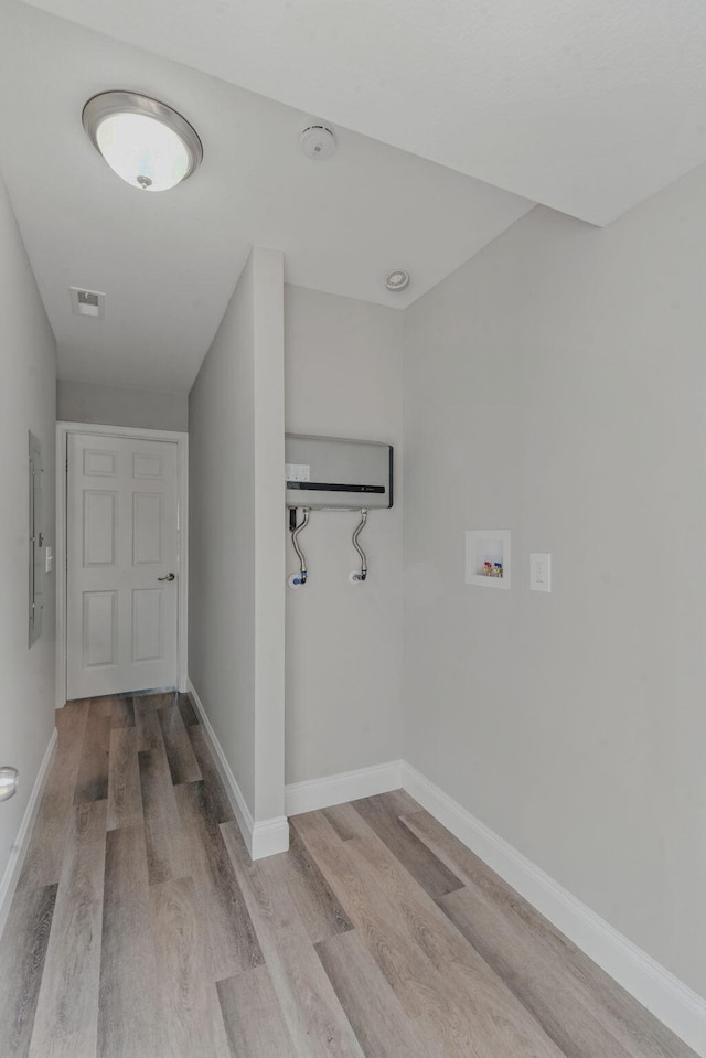 2207 Spencer Ave, Chattanooga, TN 37421 - hall featuring wood finished floors, an AC wall unit, and electric panel