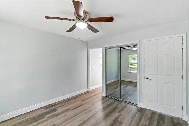 2207 Spencer Ave, Chattanooga, TN 37421 - unfurnished bedroom with wood finished floors, a closet, and a ceiling fan