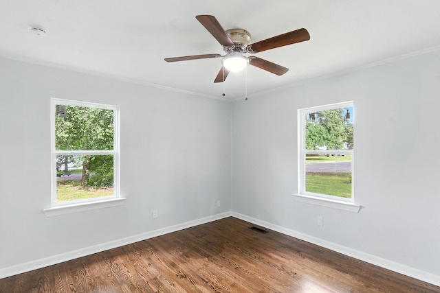 2207 Spencer Ave, Chattanooga, TN 37421 - empty room with ornamental molding, dark wood finished floors, ceiling fan, and a smoke detector
