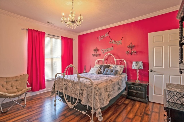 bedroom with a textured ceiling, a chandelier, dark hardwood / wood-style floors, and ornamental molding