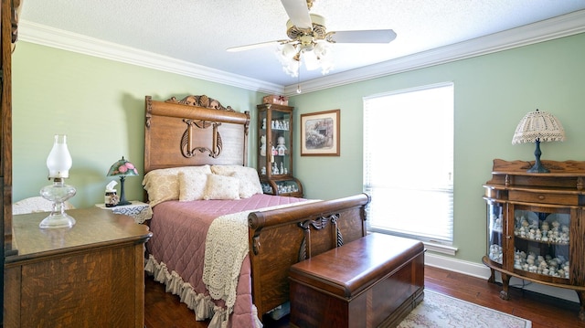 bedroom featuring ceiling fan, dark hardwood / wood-style floors, crown molding, and multiple windows