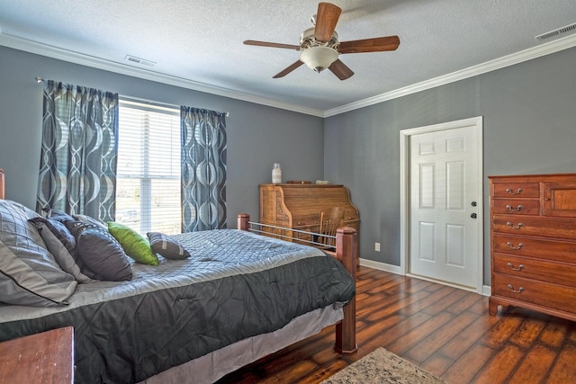 bedroom with a textured ceiling, dark hardwood / wood-style floors, ceiling fan, and ornamental molding