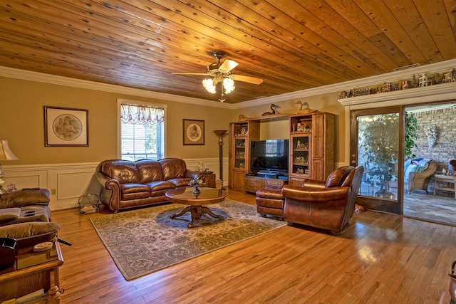 living room with ornamental molding, light wood-type flooring, ceiling fan, and wooden ceiling