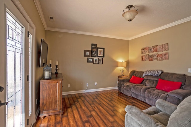 living room with dark hardwood / wood-style floors and crown molding