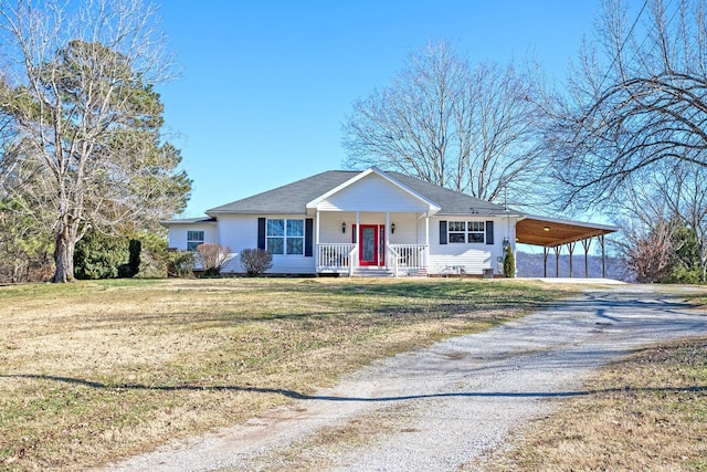 ranch-style home featuring a porch, a carport, and a front lawn