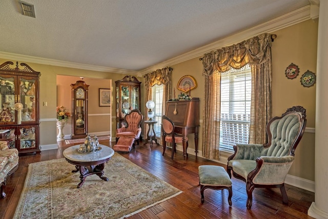 interior space featuring ornamental molding, a textured ceiling, and dark wood-type flooring