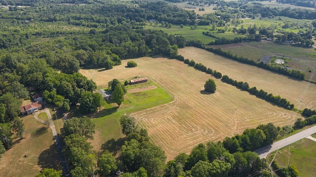 birds eye view of property with a rural view