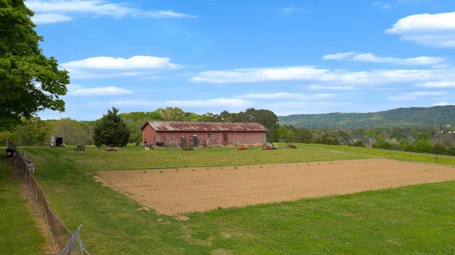 view of home's community featuring a mountain view and a rural view