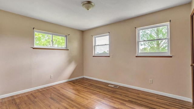 empty room featuring hardwood / wood-style floors