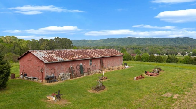 exterior space with a lawn and a mountain view