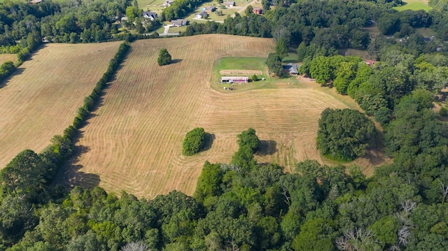 birds eye view of property with a rural view