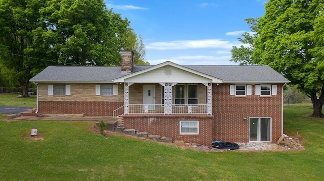 view of front of home featuring covered porch and a front yard