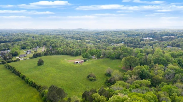 birds eye view of property with a rural view