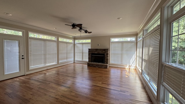 3619 Sourwood Trl, Cleveland, TN 37312 - unfurnished living room featuring crown molding, wood finished floors, a ceiling fan, a fireplace, and healthy amount of natural light