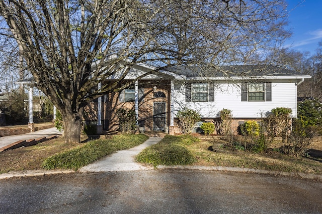 view of front of house featuring brick siding