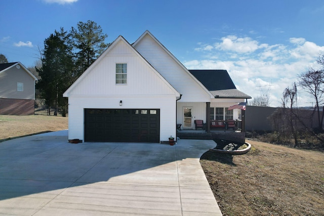 modern farmhouse style home with a garage, a porch, and a front lawn