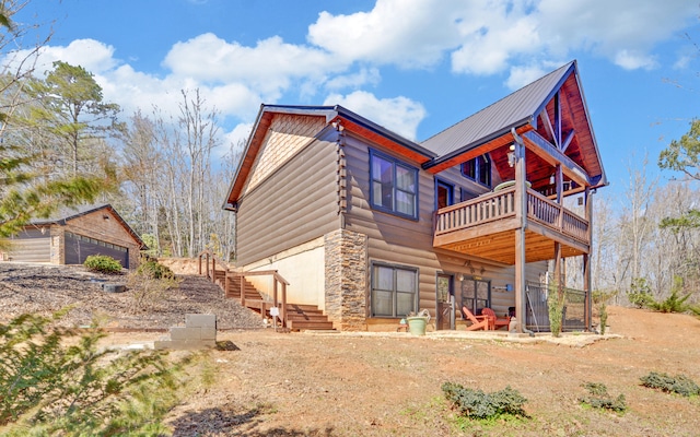 101 Hideaway Trl, Copperhill, TN 37317 - back of property with stone siding and an outdoor structure