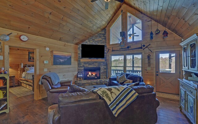101 Hideaway Trl, Copperhill, TN 37317 - living room with a ceiling fan, wood-type flooring, a stone fireplace, wood walls, and wood ceiling