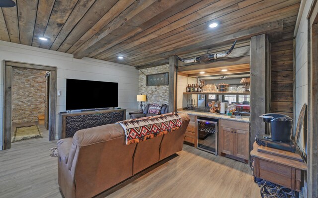 101 Hideaway Trl, Copperhill, TN 37317 - living area featuring beverage cooler, wood walls, light wood finished floors, bar area, and wood ceiling