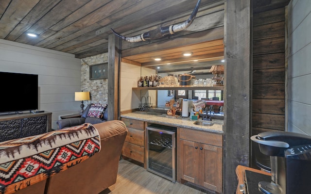 101 Hideaway Trl, Copperhill, TN 37317 - bar featuring beverage cooler, a sink, indoor wet bar, wood ceiling, and light wood-style floors