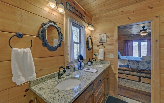 101 Hideaway Trl, Copperhill, TN 37317 - bathroom featuring a sink, a wealth of natural light, wooden walls, and ensuite bath
