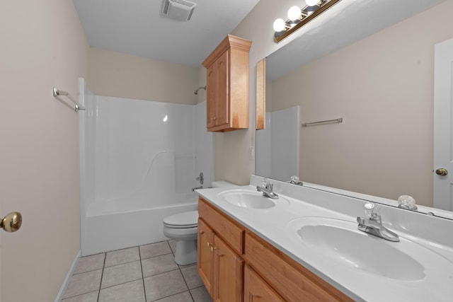 full bathroom featuring toilet, vanity, tile patterned floors, and shower / bathing tub combination