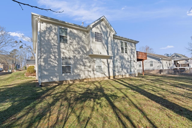 back of house with a yard