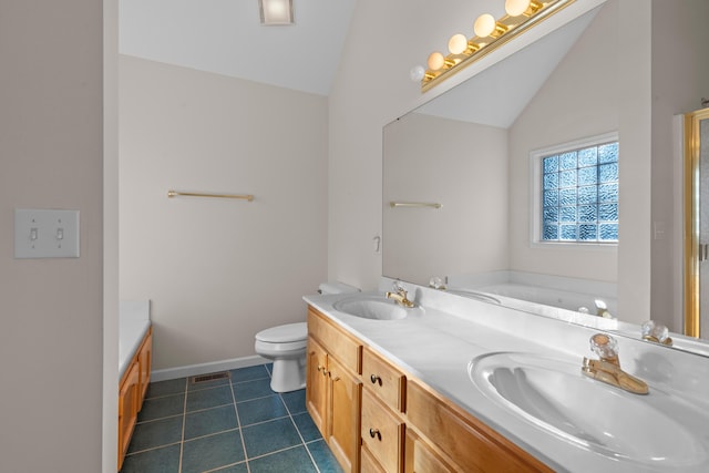 bathroom with toilet, a washtub, tile patterned floors, vanity, and lofted ceiling