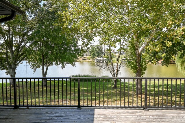 deck featuring a yard and a water view