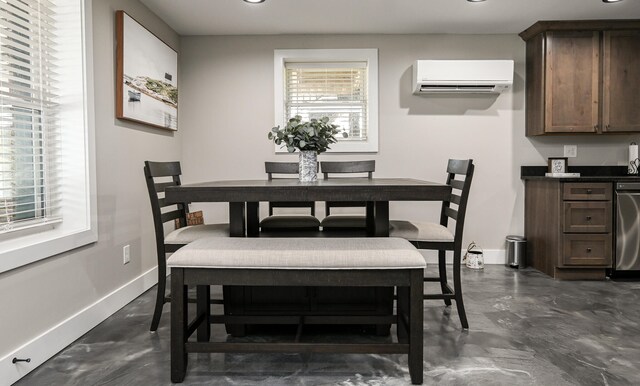 dining area featuring a wall unit AC