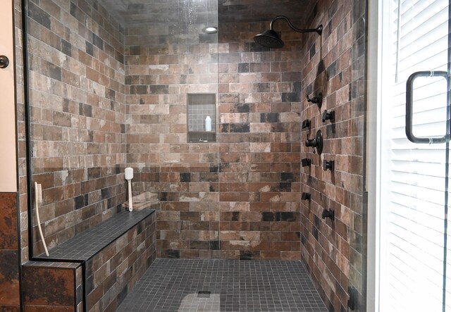 bathroom with tiled shower