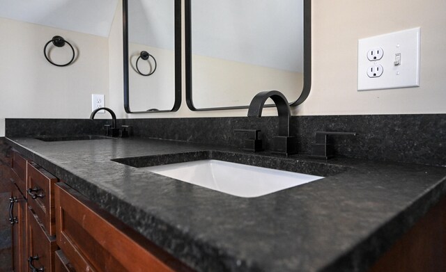 room details with vanity and tasteful backsplash