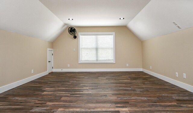 bonus room featuring dark hardwood / wood-style flooring and vaulted ceiling