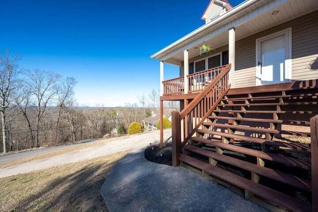 doorway to property featuring covered porch