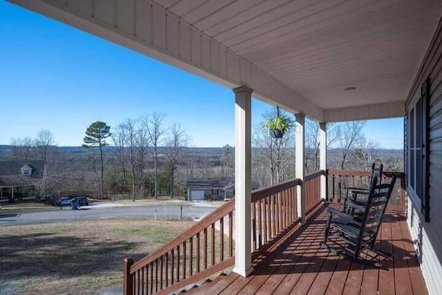 wooden terrace featuring a porch