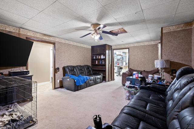 living room with carpet flooring and ceiling fan