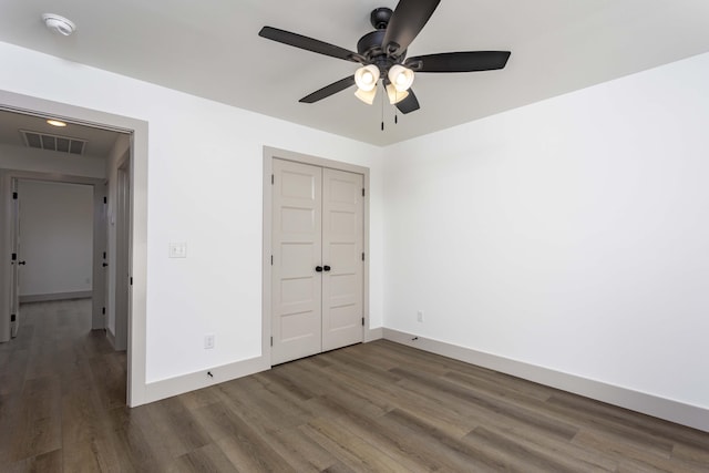 11942 Old Dayton Pike, Soddy-Daisy, TN 37379 - unfurnished bedroom featuring visible vents, a closet, wood finished floors, baseboards, and ceiling fan