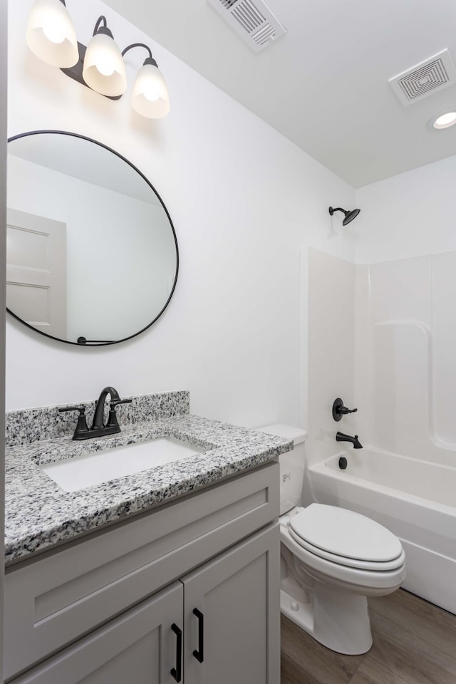11942 Old Dayton Pike, Soddy-Daisy, TN 37379 - bathroom featuring vanity, toilet, wood finished floors, and visible vents