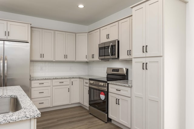 11942 Old Dayton Pike, Soddy-Daisy, TN 37379 - kitchen featuring backsplash, recessed lighting, appliances with stainless steel finishes, and wood finished floors