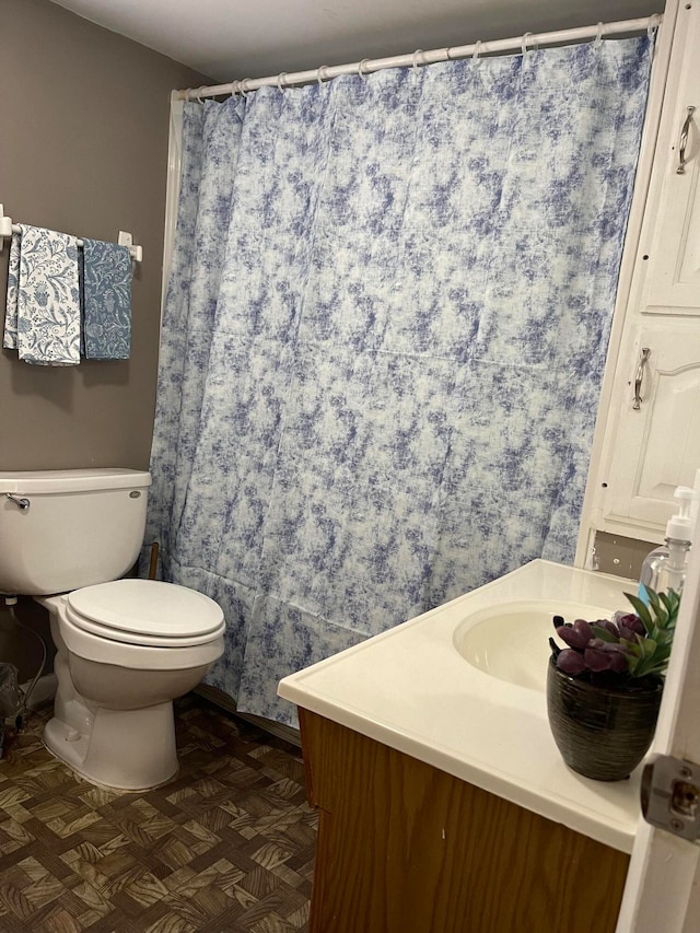 bathroom with vanity and toilet