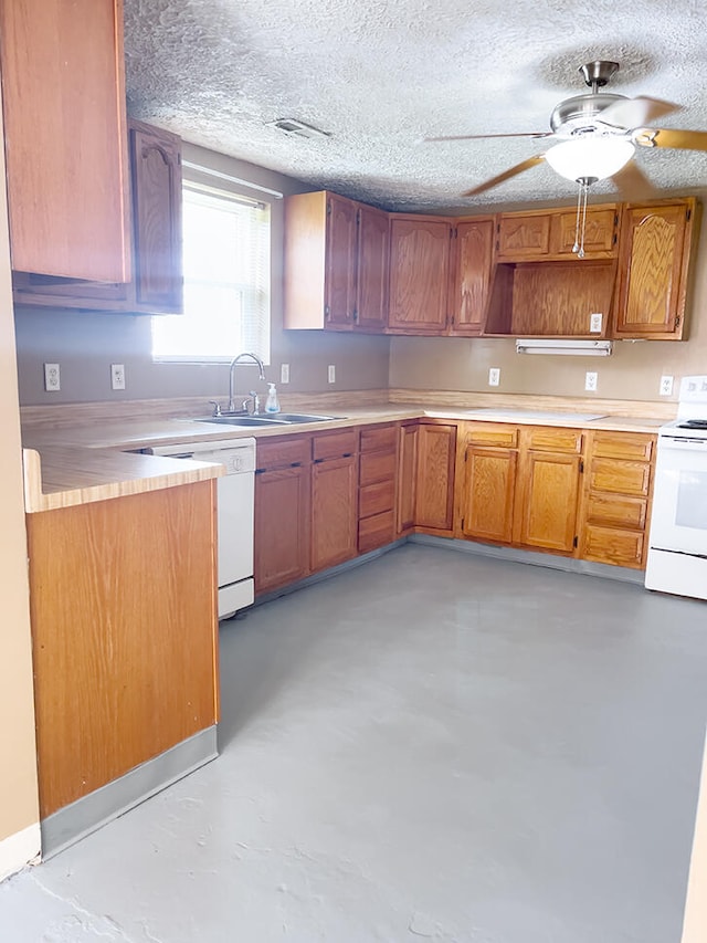 kitchen with a textured ceiling, ceiling fan, sink, and white appliances