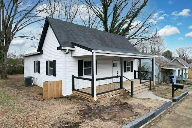 view of front facade with a porch and central air condition unit