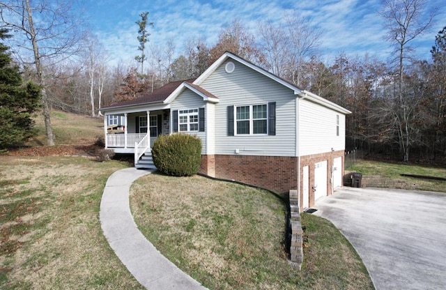 view of front of property featuring driveway, an attached garage, covered porch, a front lawn, and brick siding