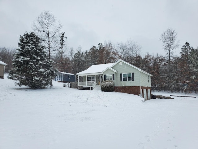 view of front of home featuring a garage and a porch