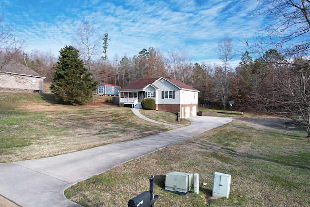 view of front of house with a garage and a front yard