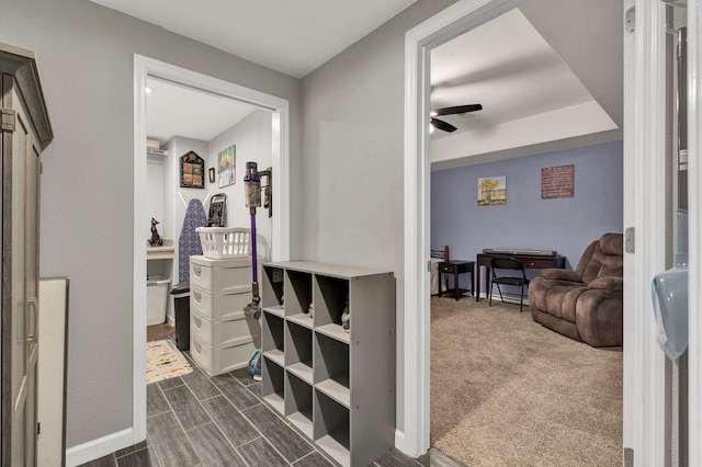 interior space with wood finish floors and dark carpet